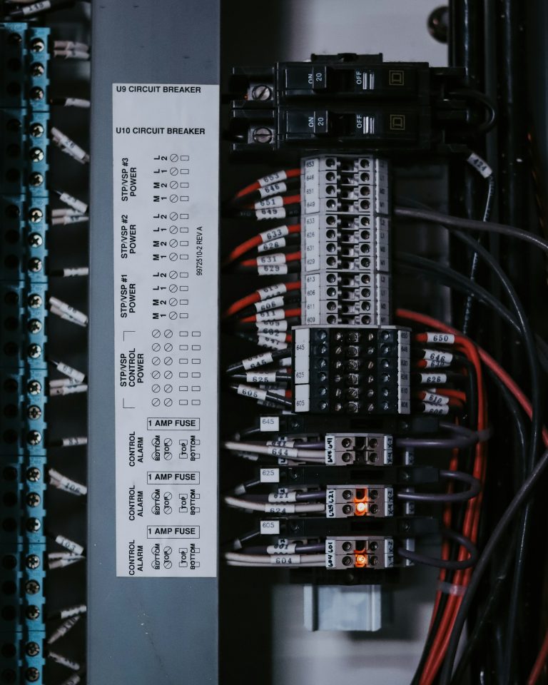 Labelled industrial control panel with numbered terminal blocks and fuses