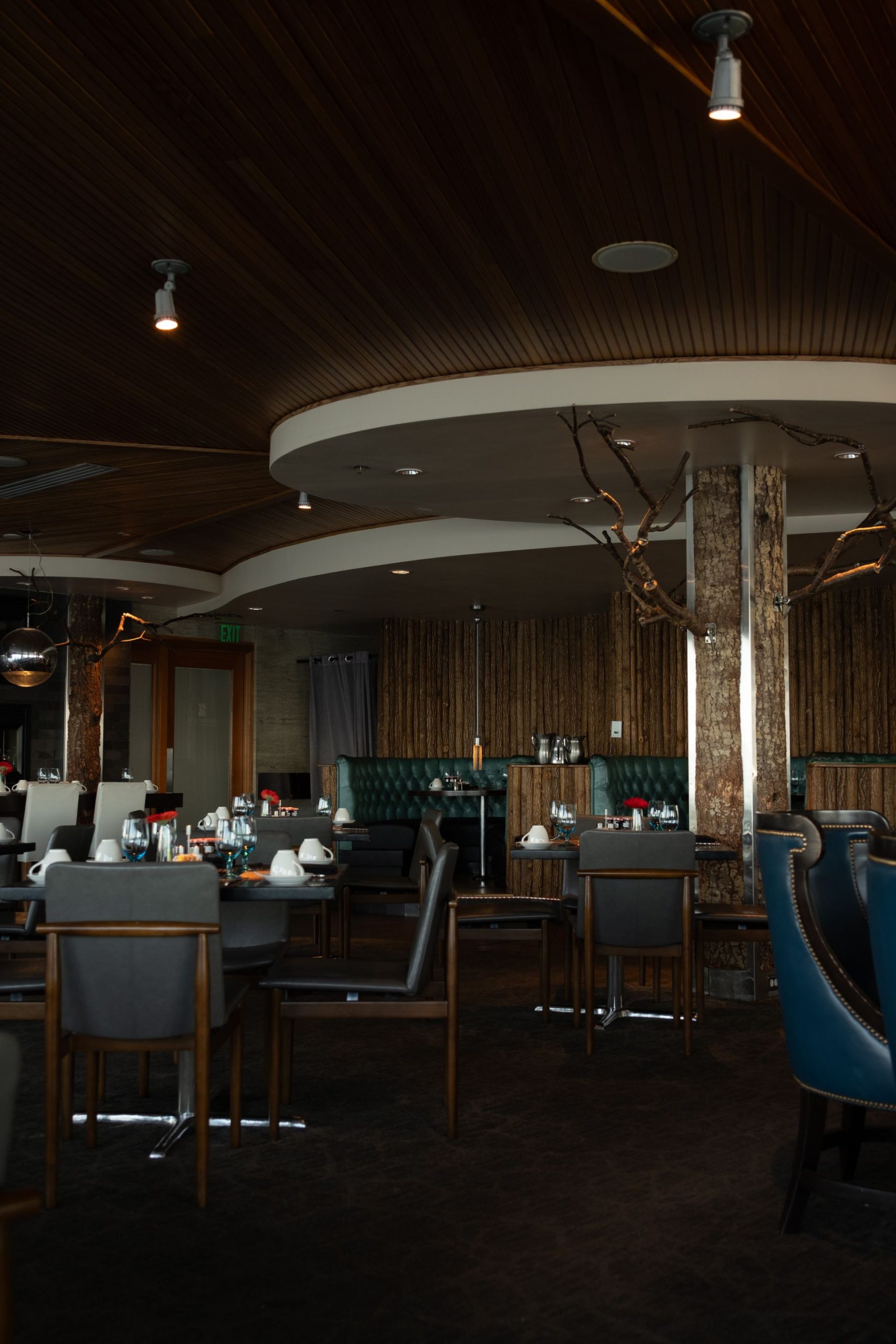 Dimly lit commercial dining room with ceiling lighting