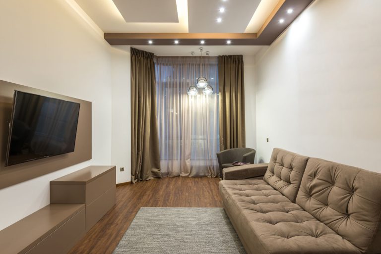 Living room lit by recessed ceiling lighting