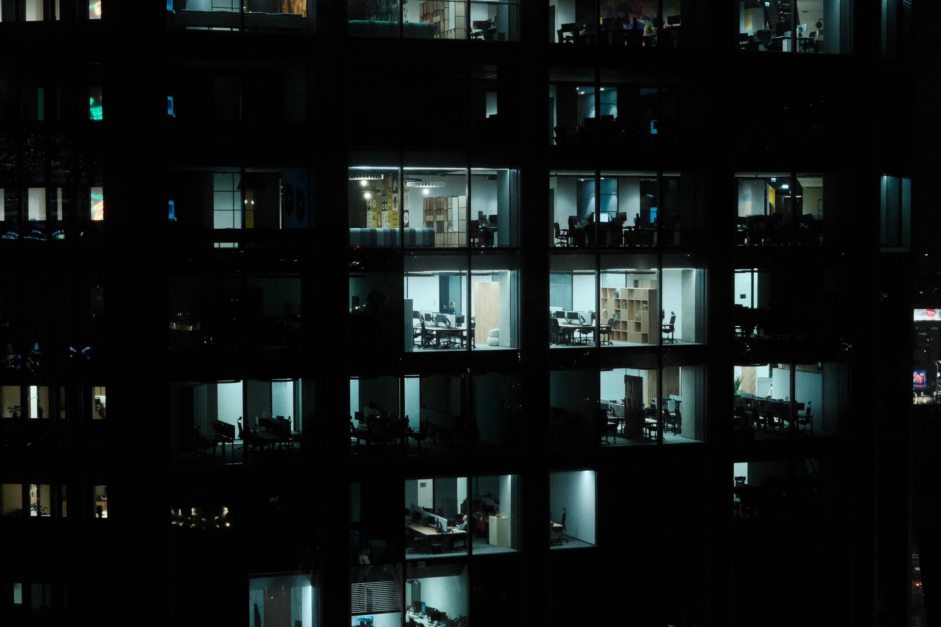 Office building at night with lit floors