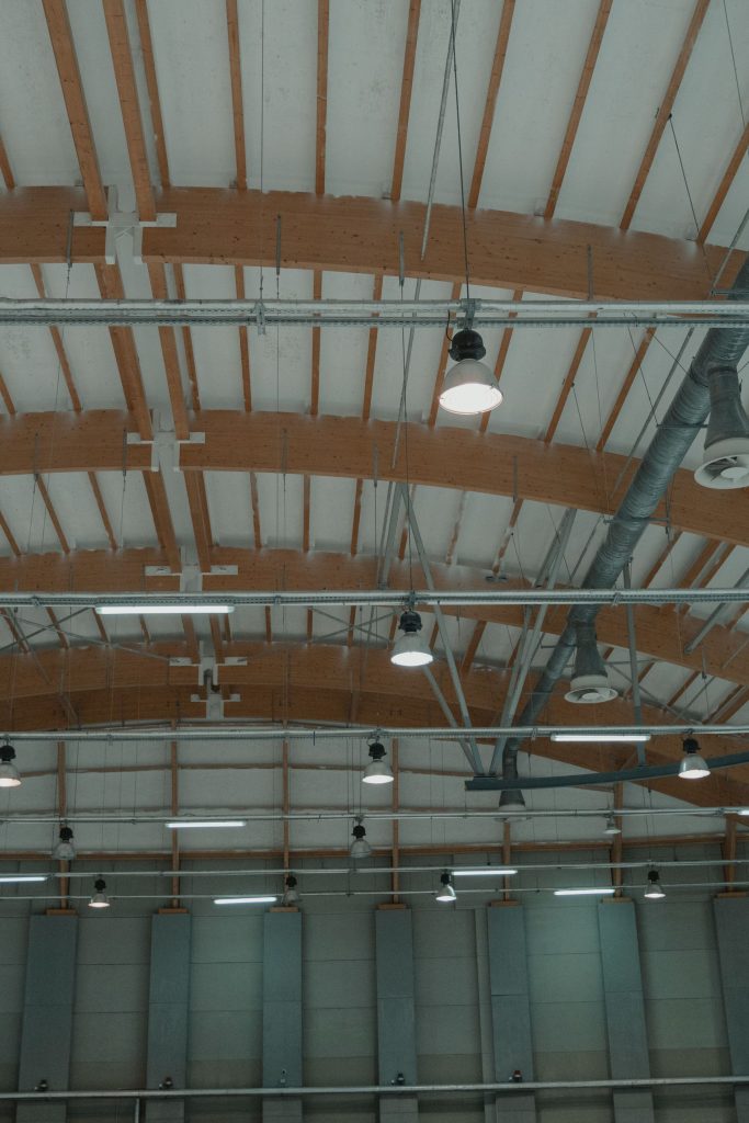 High-bay lighting across an open warehouse ceiling