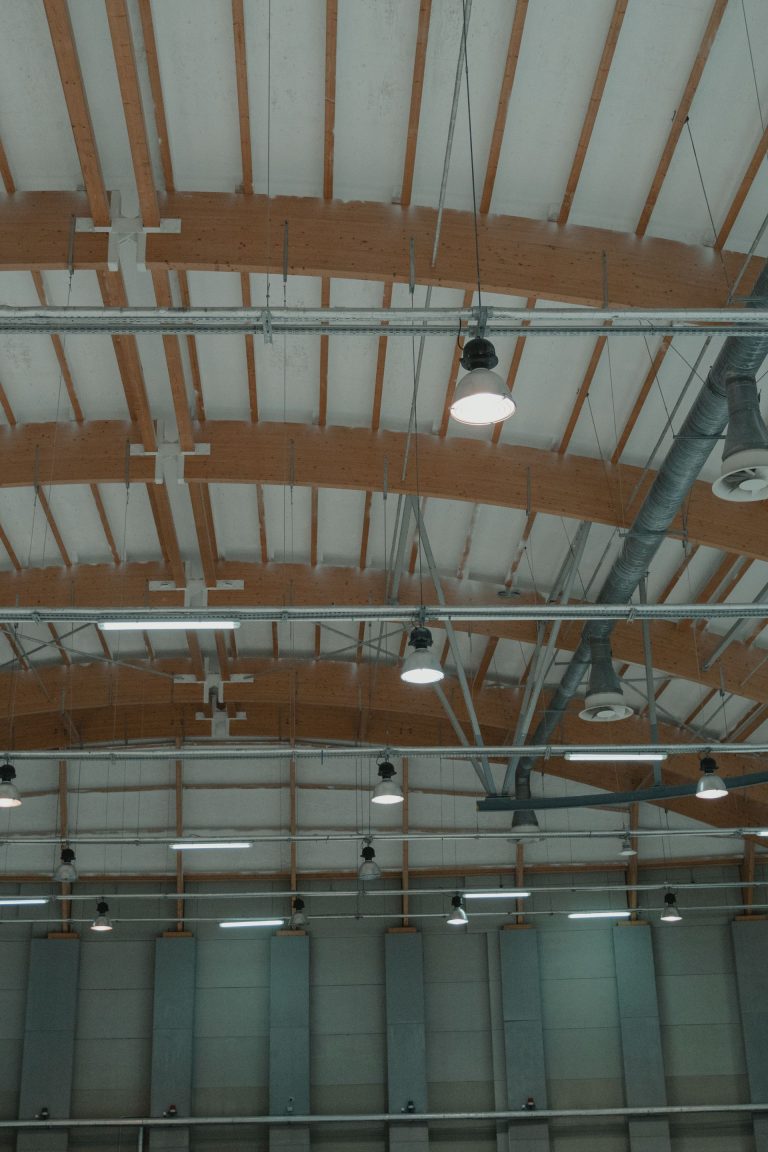 High-bay lighting across an open warehouse ceiling